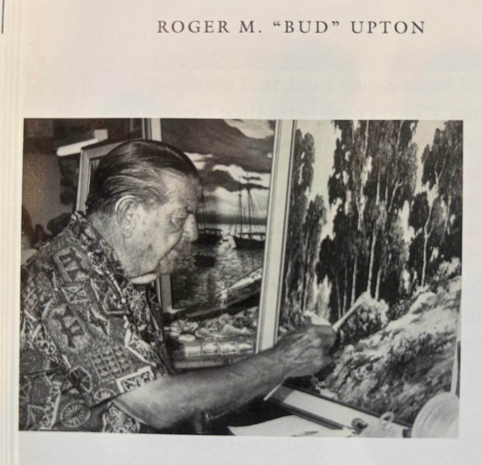 Black and white photograph of Roger M. "Bud" Upton painting a eucalyptus landscape at his easel